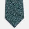 View 3 of product The Turnbull & Asser Light Petrol Paisley Silk Tie features an elegant teal and light blue paisley pattern on white English silk, highlighted by intricate, swirling designs.