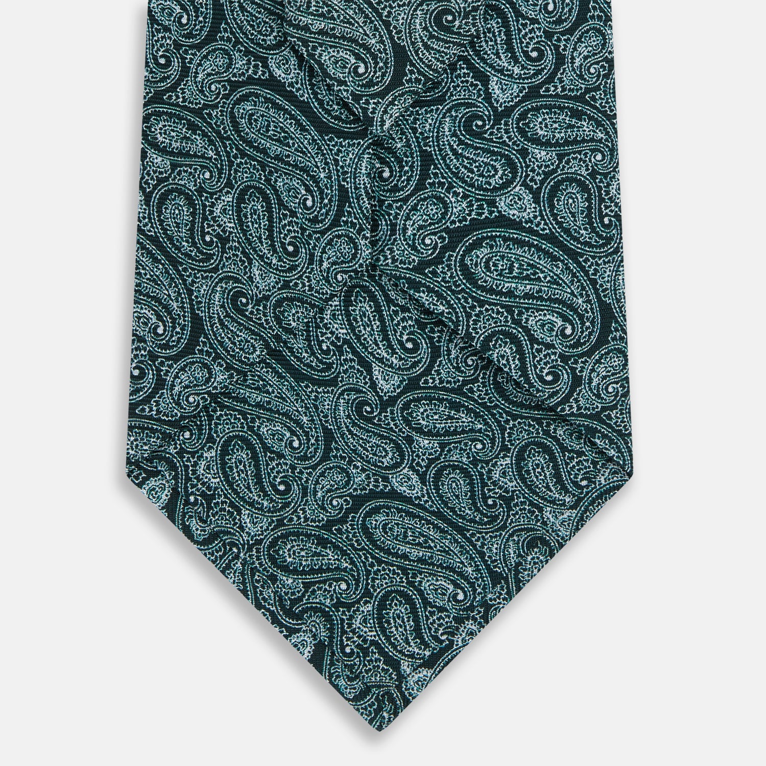 View 3 of product The Turnbull & Asser Light Petrol Paisley Silk Tie features an elegant teal and light blue paisley pattern on white English silk, highlighted by intricate, swirling designs.