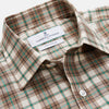 View 2 of product The Turnbull & Asser Green and Oatmeal Cotton Weekend Fit Langston Shirt features a Derby collar, long sleeves, two button-flap chest pockets, crisp white buttons, and a stylish plaid pattern.