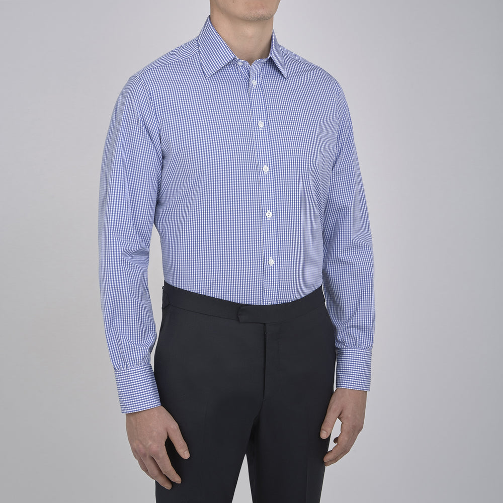 The Turnbull & Asser Mid-Blue Gingham Check Shirt features a T&A collar and 3-button cuffs, crafted from soft cotton and displayed against a plain white background.