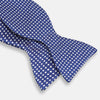 View 3 of product The Turnbull & Asser Blue and White Diamond Silk Bow Tie features a repeating pattern of small white diamonds and vertical ribbing, making it perfect for formalwear. Displayed on a white background.