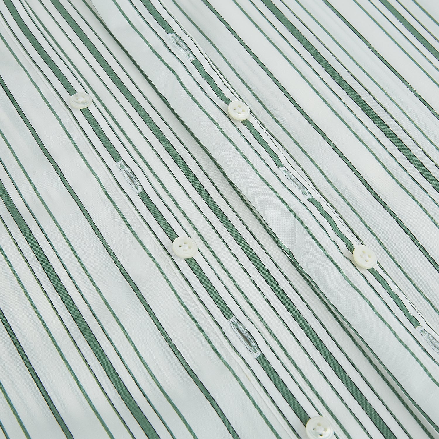 View 7 of product The SAGE GREEN MULTI STRIPE WESTMINSTER SHIRT by Turnbull & Asser features a classic collar, long sleeves, buttoned cuffs, relaxed fit, and vertical green and white stripes—embodying timeless British craftsmanship.