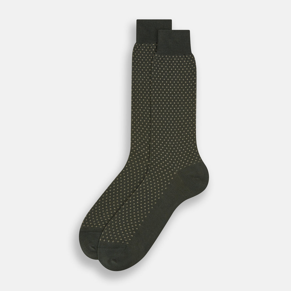 A single forest green mid-length sock from Turnbull & Asser, featuring a motif pattern and crafted from soft mercerised Egyptian cotton, shown against a plain white background.