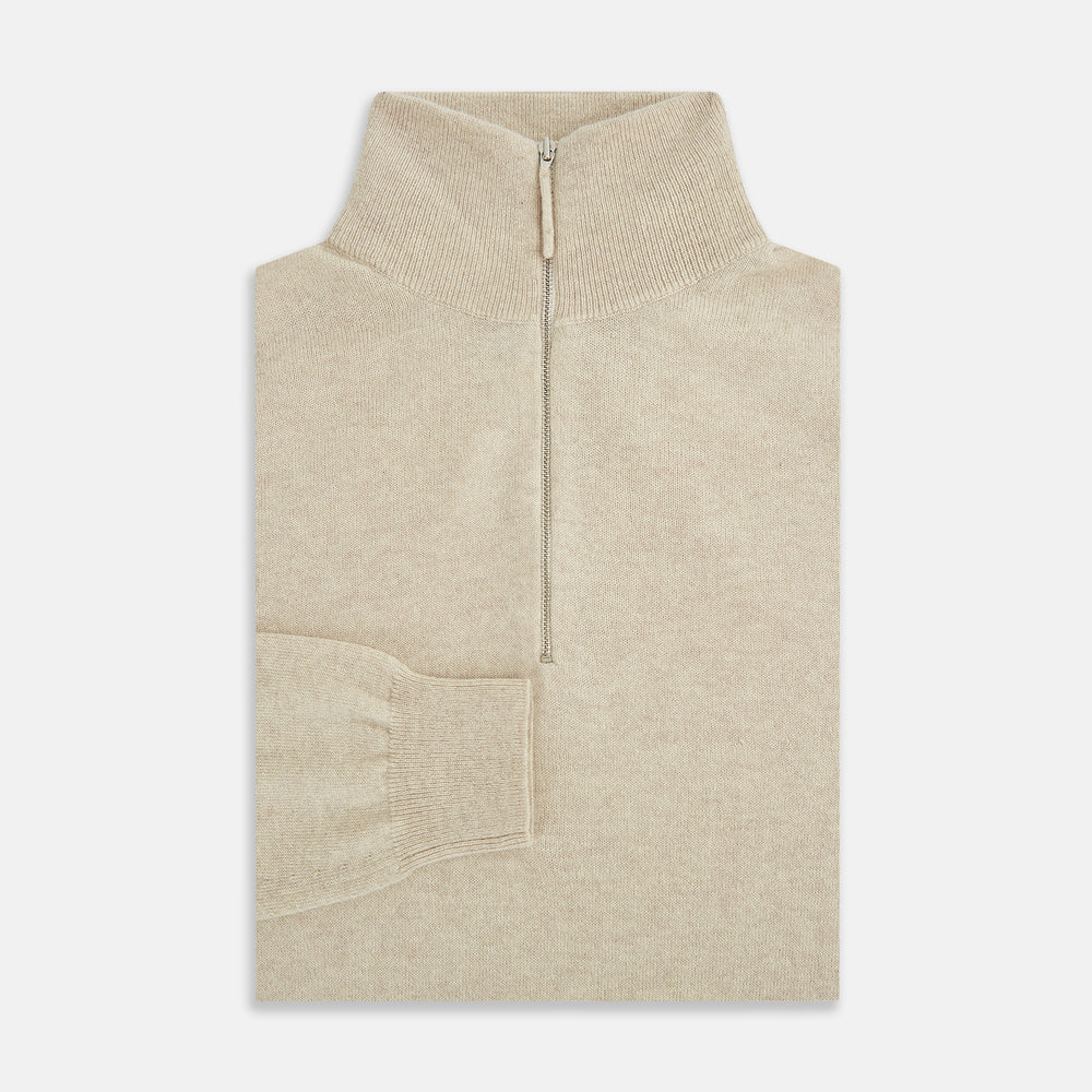 The Turnbull & Asser Cream Half-Zip Cashmere Jumper is a beige, long-sleeve pullover with a high collar, showcasing timeless knitwear style against a plain white background.