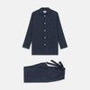 View 1 of product The Turnbull & Asser Blue Multi Check Wool Quin Pyjama Set features a long-sleeve button-up top with chest pocket and drawstring pants, both displayed flat on white—a luxurious choice for refined sleepwear.