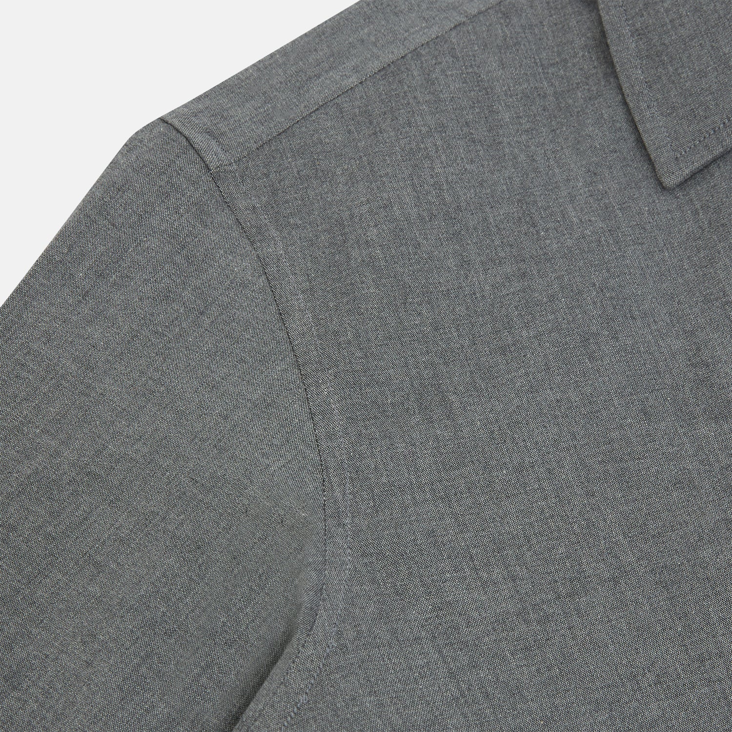 View 6 of product The Pale Charcoal Westminster Shirt by Turnbull & Asser features British craftsmanship with a tailored silhouette, long sleeves, pointed collar, buttoned cuffs, and a solid pale charcoal hue, elegantly shown against a white background.