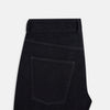 View 5 of product Turnbull & Asser Navy Denim Trousers feature a classic straight-leg cut, button and zipper closure, five-pocket workwear styling, and both front and back pockets, shown against a plain light background.