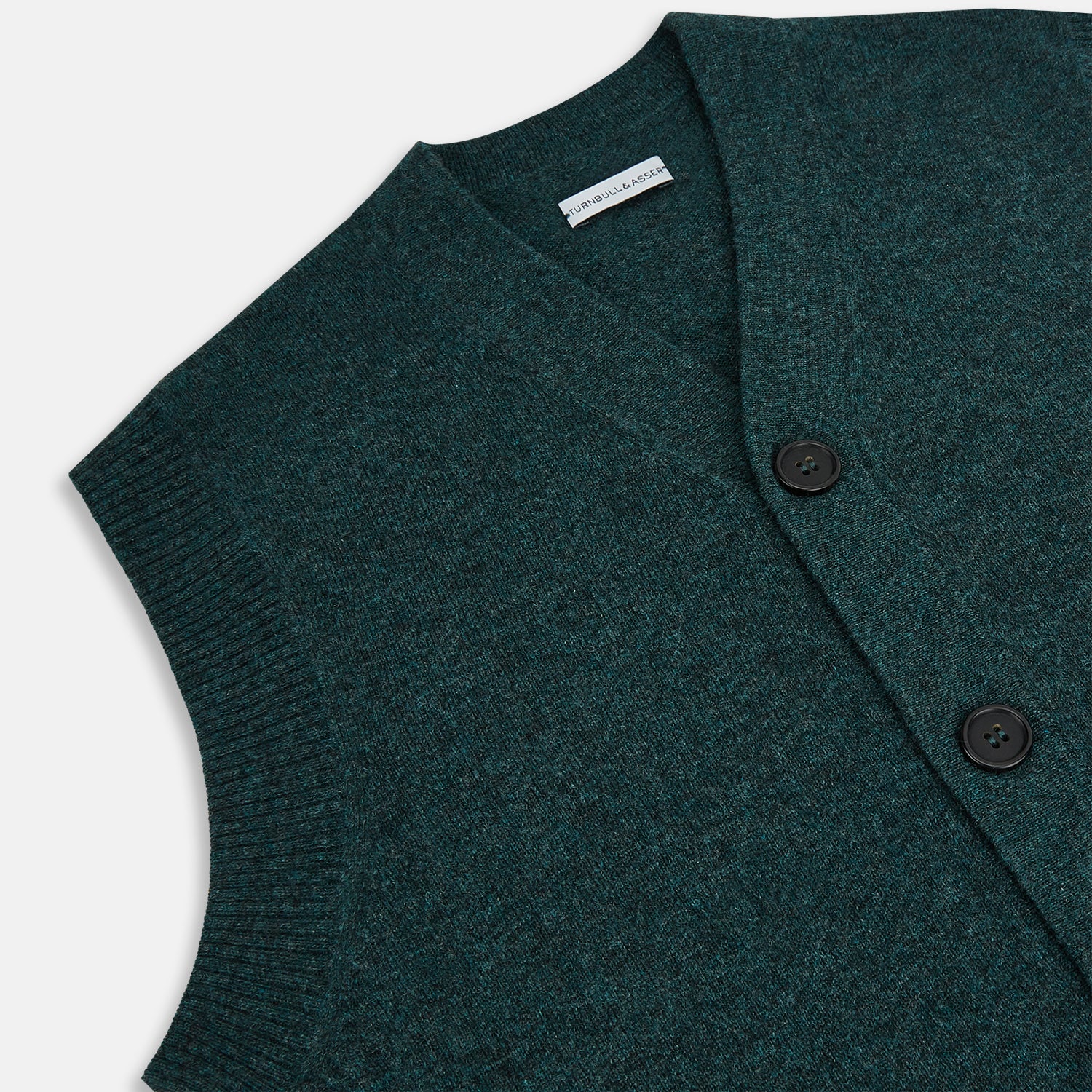 View 2 of product The Turnbull & Asser Forest Green Melange Cashmere Sleeveless Cardigan features a button-up front, two pockets, ribbed hem, and round neckline, shown on a white background.