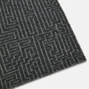 View 2 of product The Turnbull & Asser Grey Fretwork Cashmere Knitted Scarf showcases a geometric maze-like pattern in gray, elegantly looped with draped ends—an essential accessory set against a plain white background.