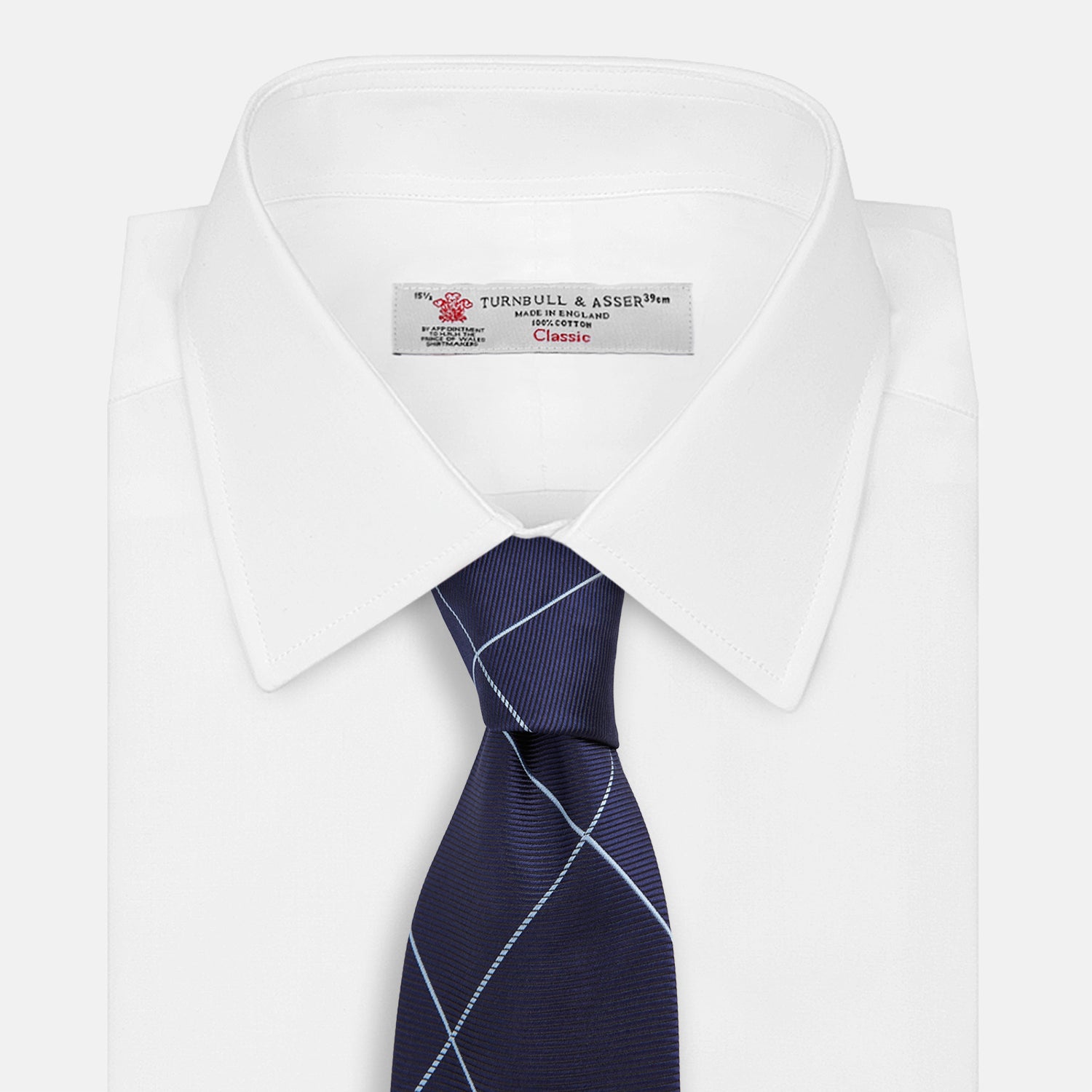 View 2 of product The Turnbull & Asser WINDOW PANE NAVY RIVER TIE features a navy blue base with a subtle light blue check pattern, elegantly rolled on a white background—a sophisticated men's accessory for any wardrobe.