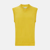 View 1 of product The Turnbull & Asser Canary Yellow Fine Merino V-Neck Vest is a sleeveless knit sweater with ribbed trim, adding elegance to any gentleman's outfit. Shown here on a plain white background.