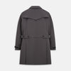View 3 of product The Turnbull & Asser Charcoal Melange John Arthur Trench Coat, featuring a collar, single-breasted closure, and three zippered pockets—one chest and two at the hips—is shown against a plain white background.