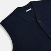 View 2 of product The Turnbull & Asser Navy Cashmere V-neck Sleeveless Cardigan features a button-up closure and two front pockets, ideal for elegant, gentleman-inspired looks, shown on a plain white background.