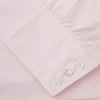 View 3 of product The Turnbull & Asser Pink Cotton Shirt features a T&A collar, 3-button cuffs, and a clean-cut design, displayed neatly folded against a plain white background.