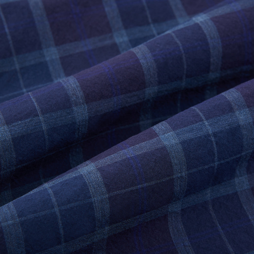 The Turnbull & Asser Navy and Purple Plaid Check Padded Gilet is sleeveless, has a front zipper, two zippered side pockets, a small chest pocket, and is shown on a plain white background.