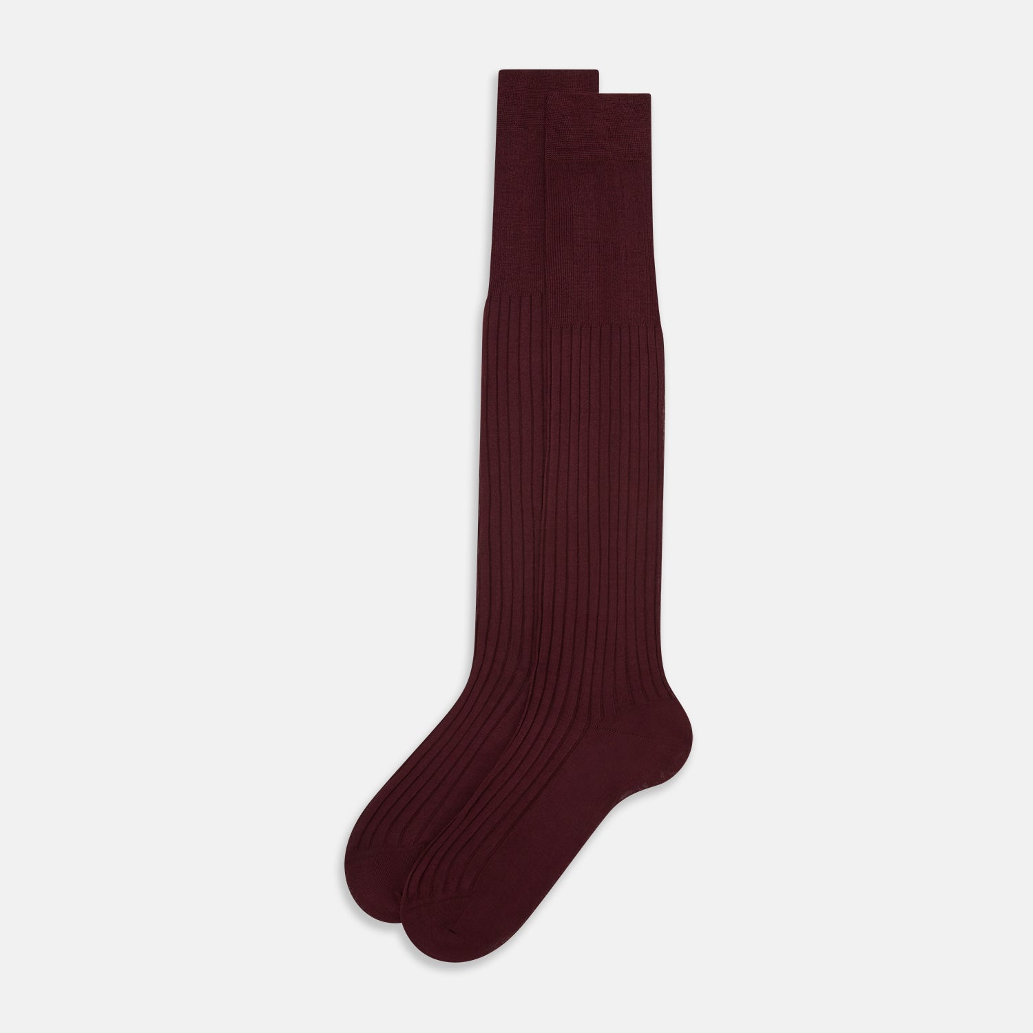 View 2 of product A single Burgundy Long Sock by Turnbull & Asser is shown on a white background, angled to display its over-the-calf length, fitted shape, and ribbed texture along the calf and foot.