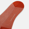 View 3 of product Turnbull & Asser's Rust/White Thin Striped Long Socks feature thin vertical stripes with a solid burnt orange cuff, heel, and toe. A single over-the-calf sock displayed on white background—ideal for those seeking stylish long socks.