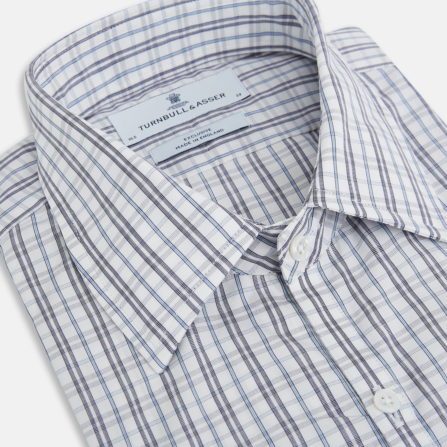 View 2 of product The Turnbull & Asser Navy and Blue Multi Tattersall Westminster Shirt features long sleeves, a button-down style, and a Turnbull collar in a blue and gray check pattern on white, laid flat against a white background.