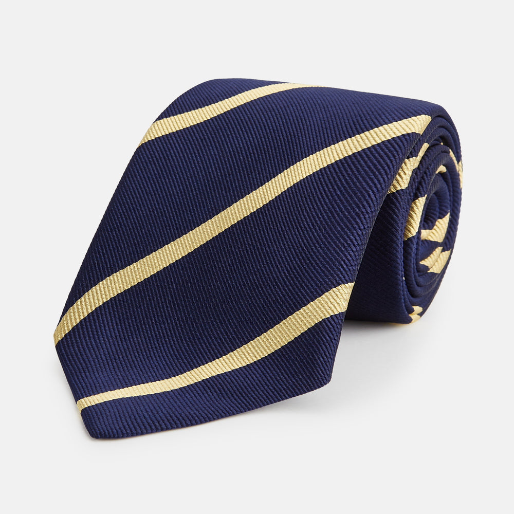 The Turnbull & Asser BLAZER STRIPE NAVY LEO TIE features classic navy with diagonal yellow stripes—an essential accessory to elevate any smart outfit.