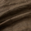 View 5 of product The Turnbull & Asser Pine Cone Quilted Linen Herringbone Waistcoat features a brown, sleeveless design with dark buttons, two angled side pockets, and a chest pocket, shown on a plain white background.