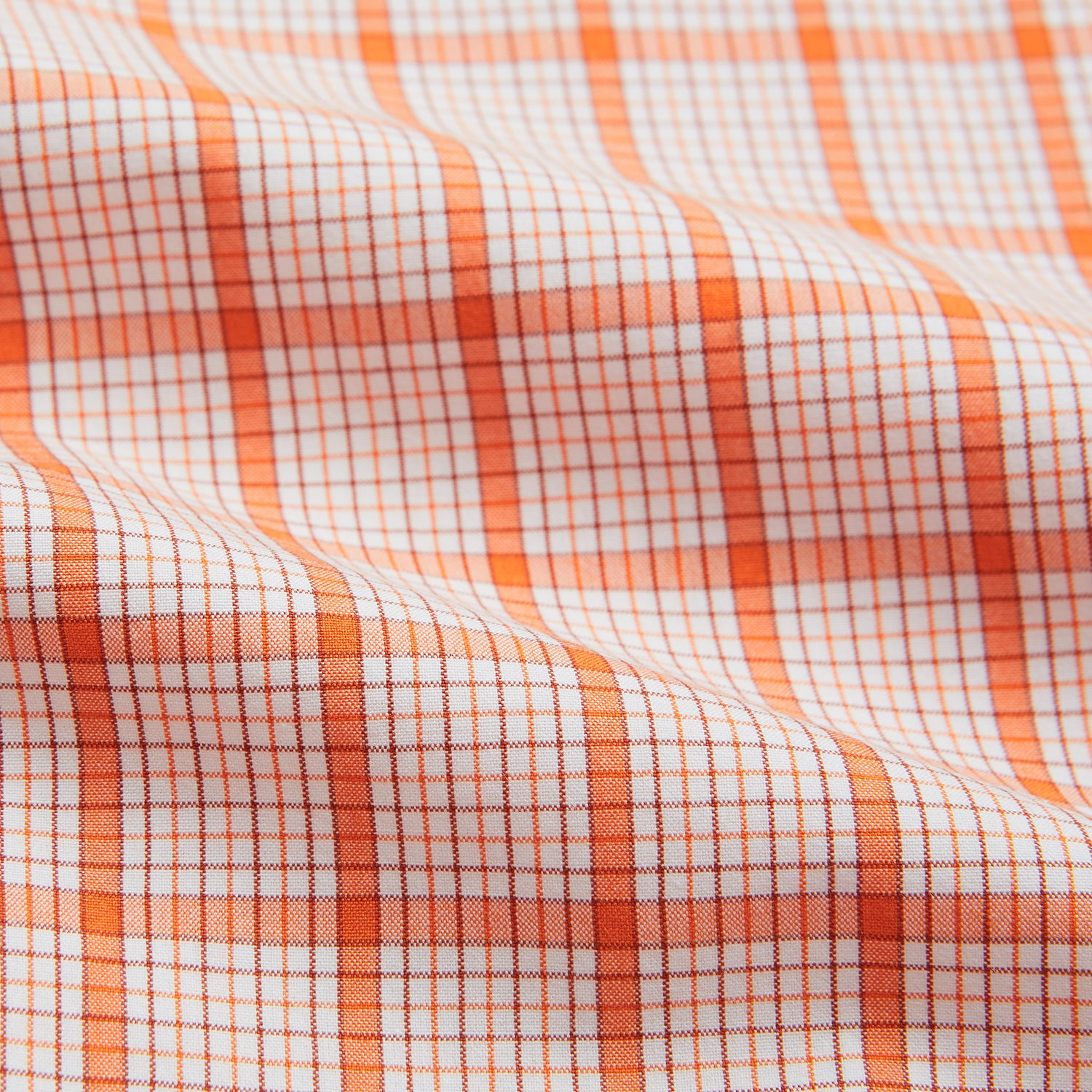 View 5 of product The Turnbull & Asser Orange Graph Overlay Check Mayfair Shirt is a soft organic cotton long-sleeve with button-down front, collar, and cuffs—an ideal capsule wardrobe staple—shown on a plain white background.