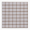 View 5 of product The Turnbull & Asser Hand Rolled Brown Overlay Check Handkerchief is a rectangular white cotton accessory with evenly spaced brown and black grid lines, forming squares—a timeless classic for gentlemen.
