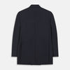 View 3 of product The Classic Navy Wool Blazer by Turnbull & Asser is a nautical double-breasted jacket with gold buttons, peaked lapels, three front pockets on one side, one on the other, and four gold buttons per cuff, shown against a white background.