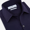 View 2 of product The Navy Textured Windsor Shirt by Turnbull & Asser features long sleeves, a Windsor collar, buttoned cuffs, and white buttons—a fine example of British craftsmanship—set against a plain white background.