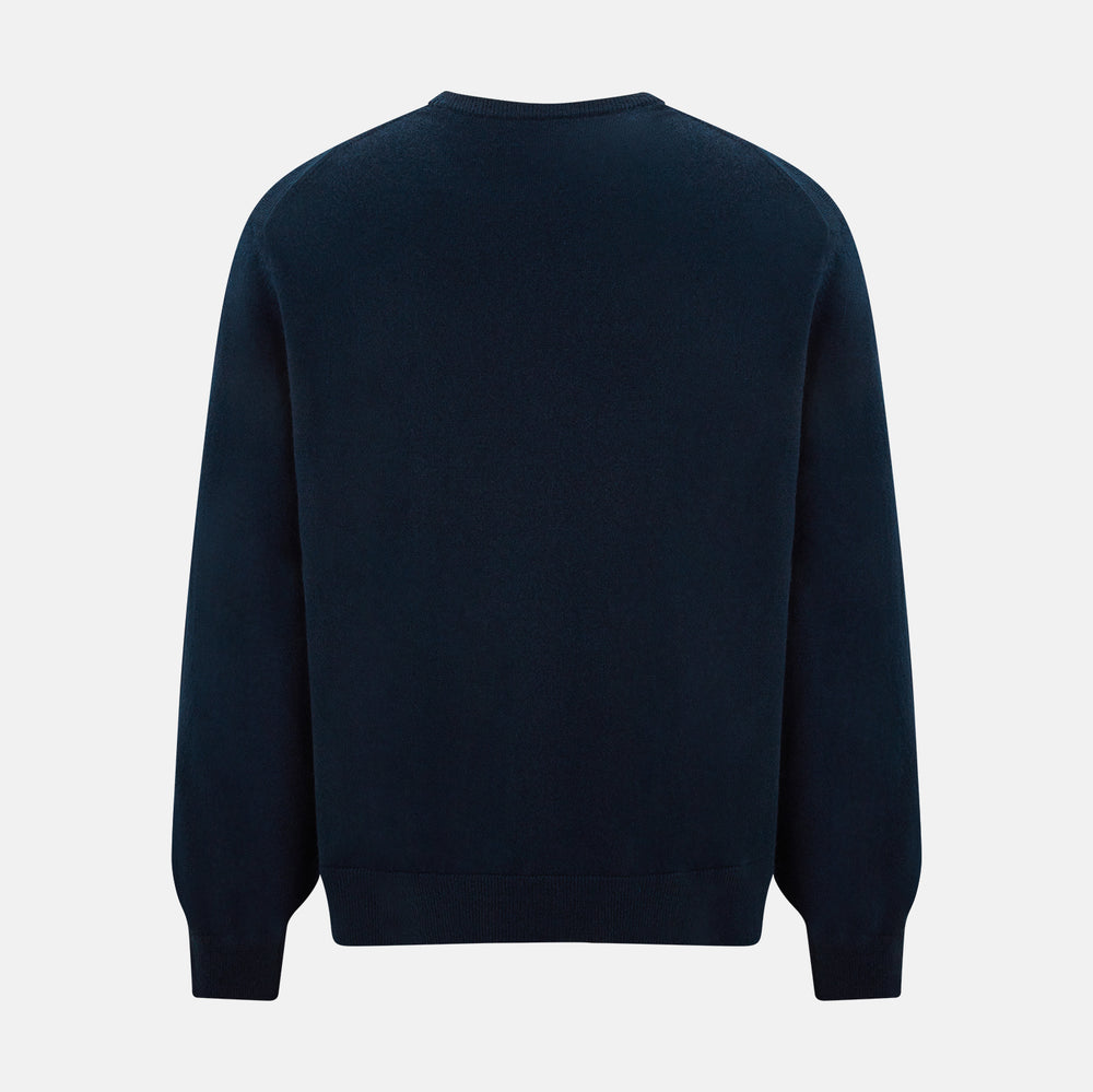 The Turnbull & Asser Navy Cashmere Round Neck Jumper for men is shown against a white background, featuring long sleeves, a relaxed fit, and ribbed cuffs, hem, and collar for an effortlessly elegant look.