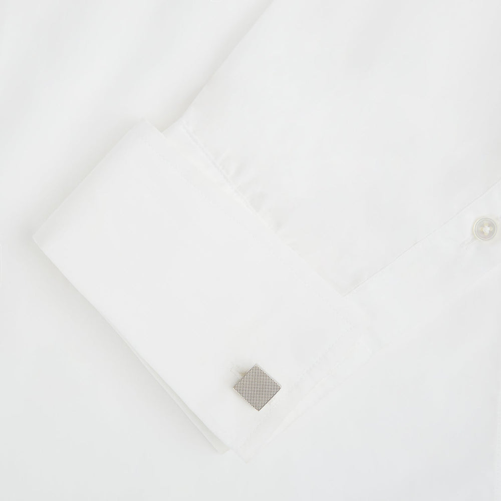 Turnbull & Asser's Silver Textured Square Cufflinks feature a dotted, polished finish and are showcased against a plain white background.