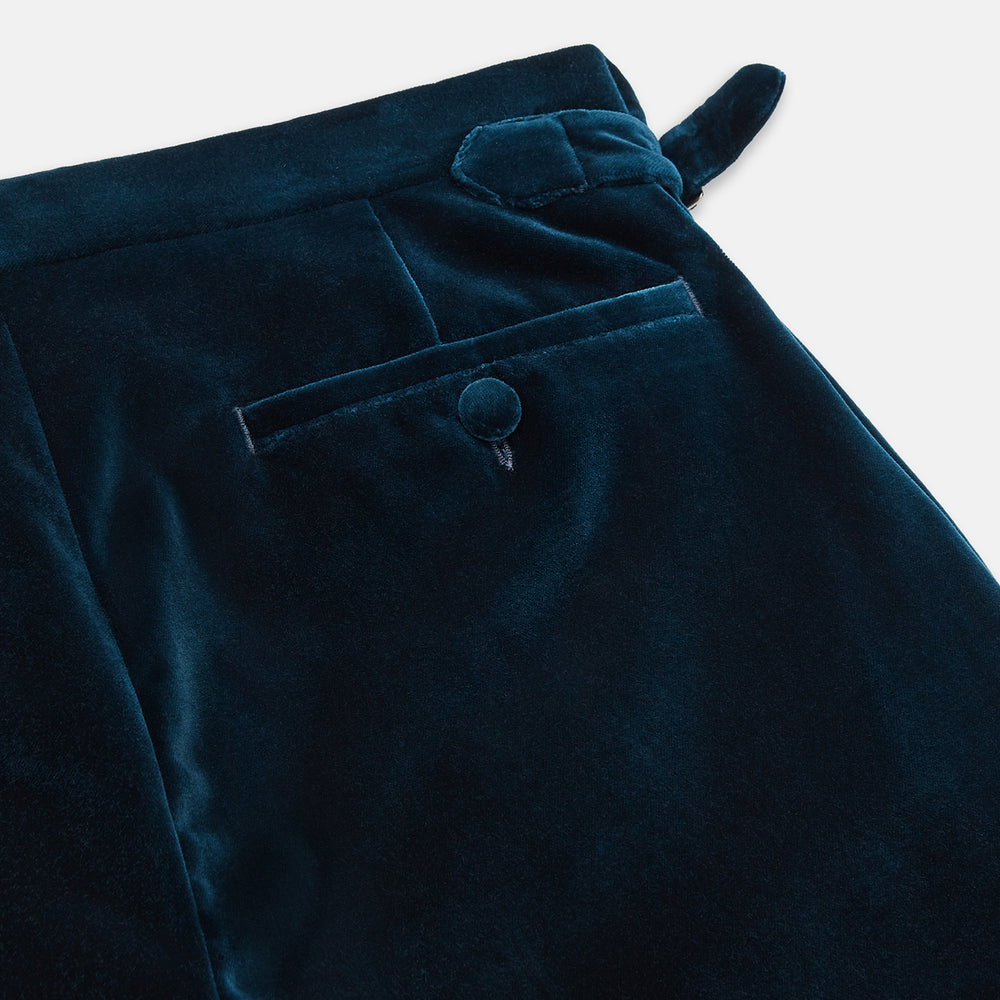 The Teal Velvet Jonathan Trousers by Turnbull & Asser feature a side tab adjuster, straight legs, and a concealed front closure for a refined tailored look, shown on a white background.