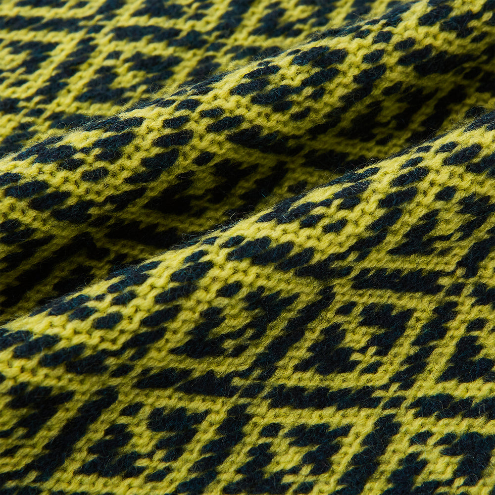 A Petrol Green and Chartreuse diamond-patterned cashmere knitted scarf by Turnbull & Asser—an essential accessory for adding striking geometric flair to any look.