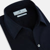View 2 of product The NAVY BLUE WINDSOR SHIRT by Turnbull & Asser features long sleeves, a classic Windsor collar, white buttons, and buttoned cuffs—highlighting refined British craftsmanship against a plain white background.
