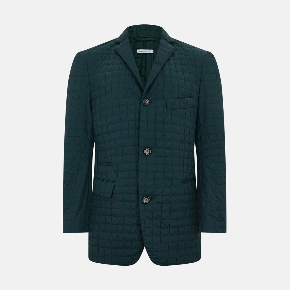 The Turnbull & Asser Fulham Forest Green Single-Breasted Quilted Blazer features a three-button front, notched lapels, chest pocket, and two front flap pockets—an elegant choice for the modern gentleman on a plain white background.