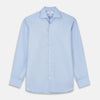 View 1 of product Turnbull & Asser's Tailored Fit Blue Cotton Shirt features a Kent collar, 3-button cuffs, and a clean design—ideal with a navy suit. Displayed on a plain white background.