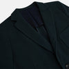View 2 of product The Forest Green KNITTED CAMBRIDGE BLAZER by Turnbull & Asser, crafted from textured Italian wool with notch lapels, patch and chest pockets, and two buttons, is shown against a plain white background.