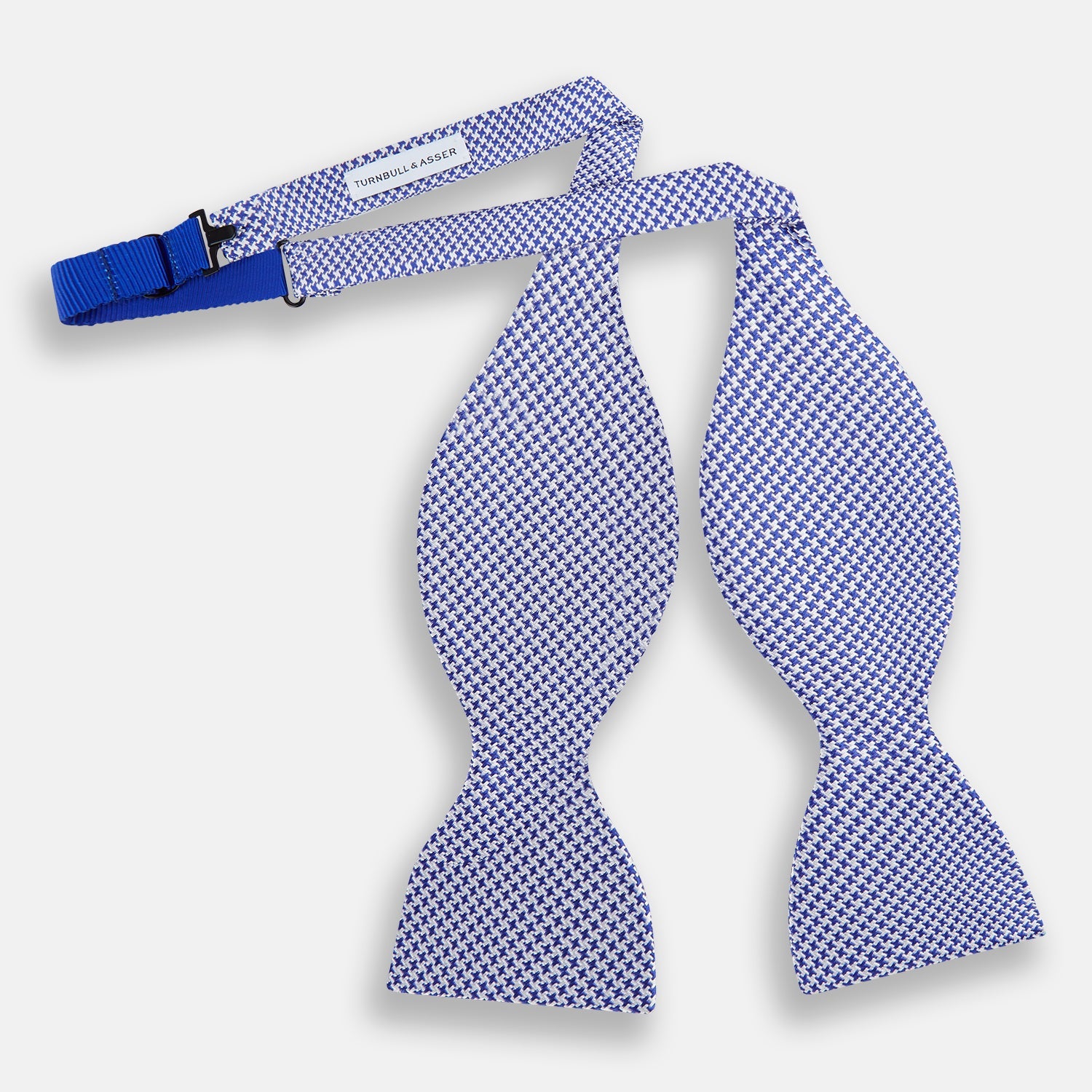 View 2 of product The Turnbull & Asser Navy and White Houndstooth Silk Bow Tie features a neatly centered knot, shown on a white background—an elegant formalwear accessory.