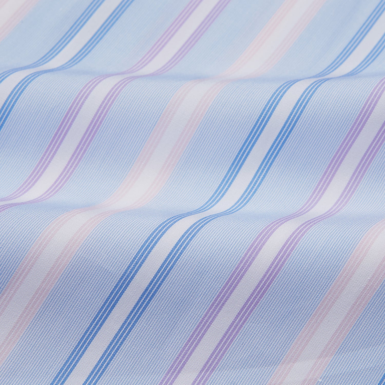 View 4 of product The Turnbull & Asser Light Blue Multi Stripe Cotton Regular Fit Penrose Shirt features light blue, white, and pink stripes with a crisp white collar and cuffs, displayed on a white background.