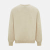 View 3 of product The Turnbull & Asser Cream Cashmere Round Neck Jumper features long sleeves, ribbed cuffs, and a ribbed hem—a versatile men’s knitwear staple, shown against a white background.