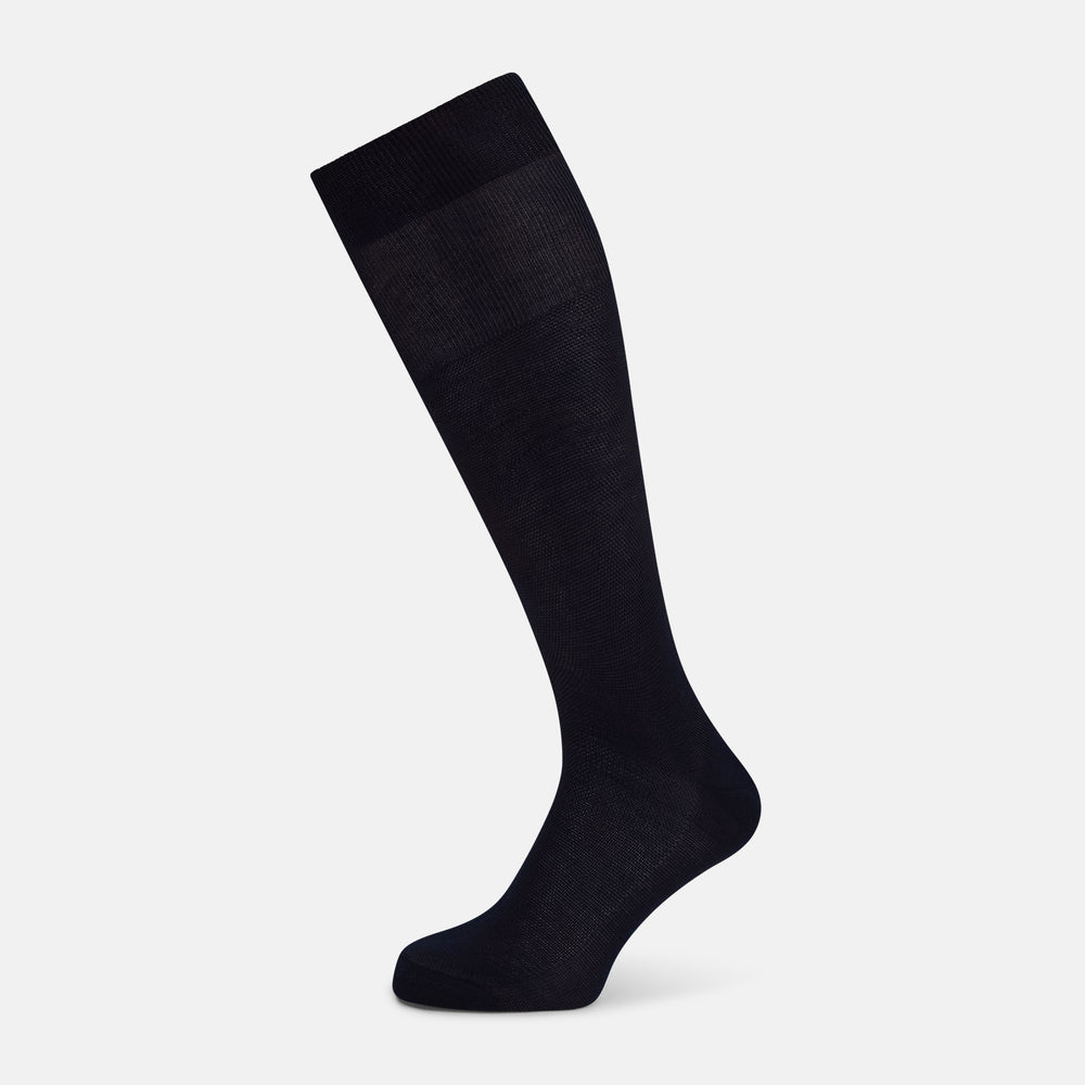 A single Turnbull & Asser Navy Micro Knit Long Sock is shown in a side profile against a plain white background, with the toe pointing downward and the cuff at the top.