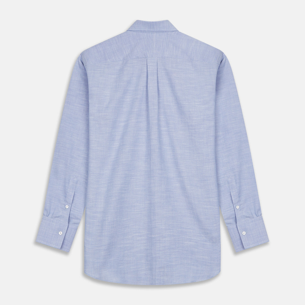 The Turnbull & Asser Mid-Blue Chambray Weekend Fit Shirt features a Dorset collar, white buttons, and 1-button cuffs. It is laid flat on a white background.