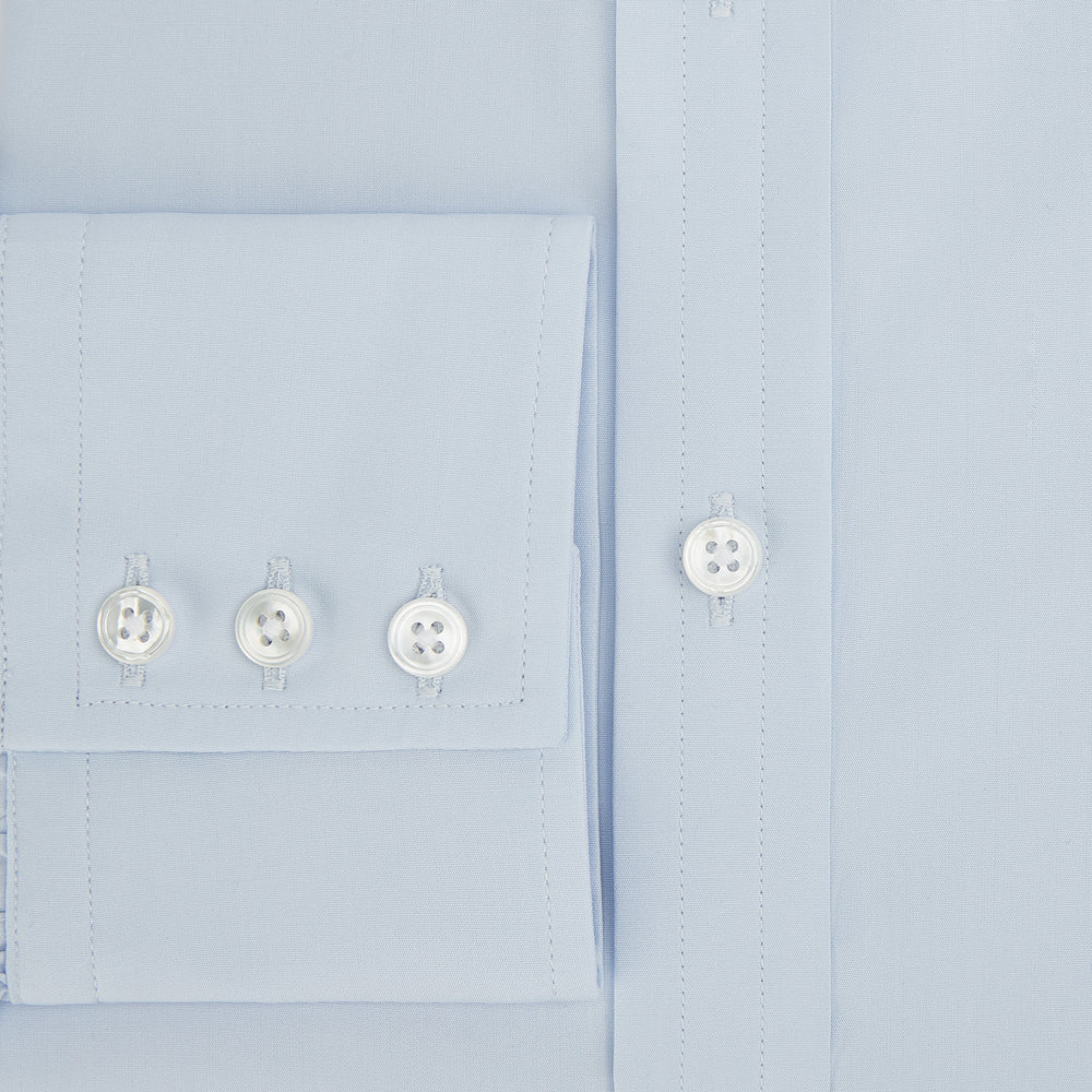 The Turnbull & Asser Pale Blue Cotton Regular Fit Mayfair Shirt features a classic collar, white buttons, and buttoned cuffs. This long-sleeve dress shirt displays the timeless Mayfair silhouette for a refined look.