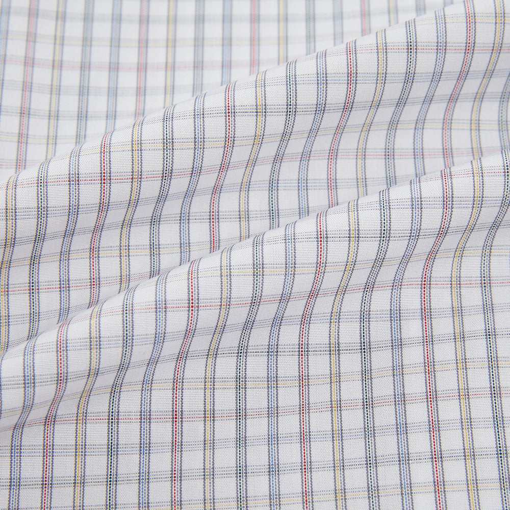 The Turnbull & Asser Sky Blue Multi Graph Check Shirt features long sleeves, a button-up front, pointed T&A collar, buttoned cuffs, and a small blue-and-white check pattern, shown on a white background.