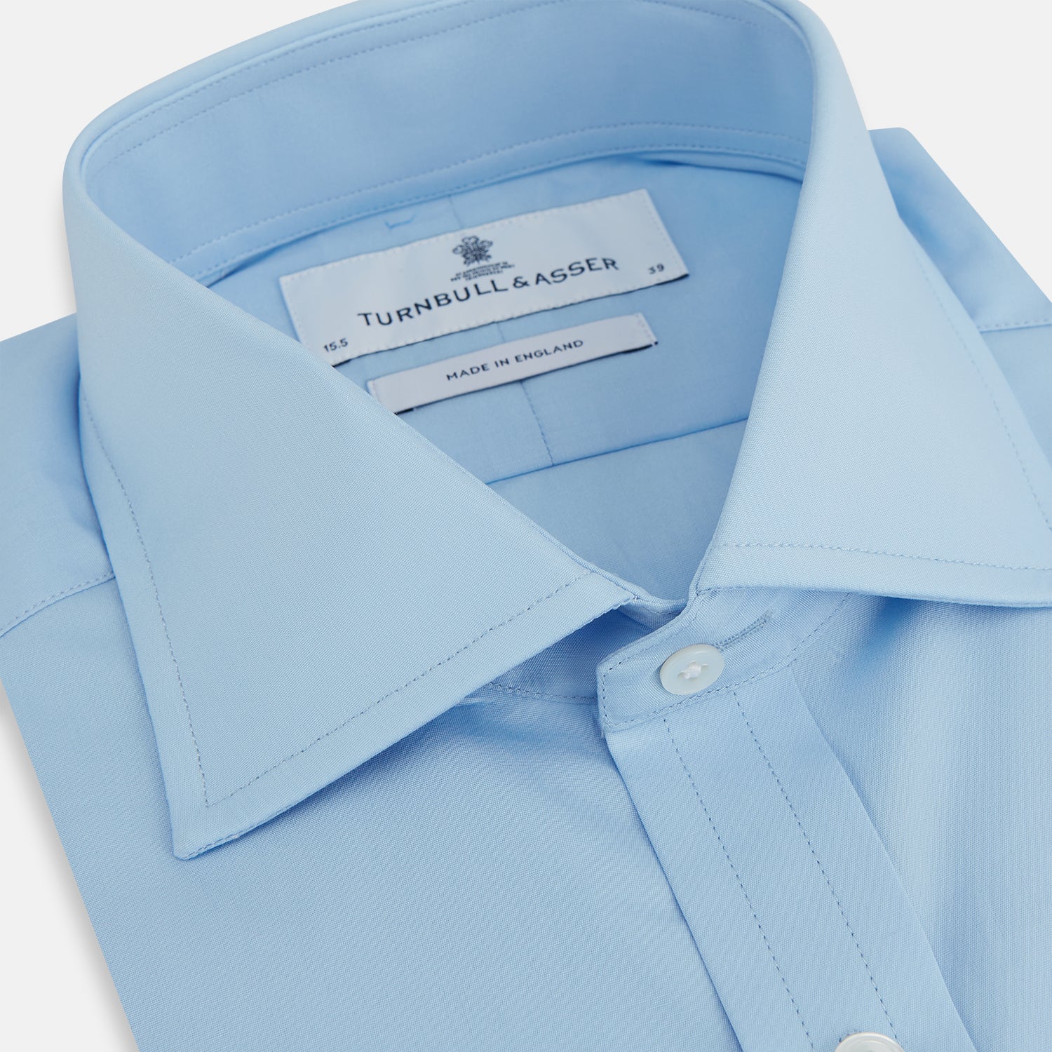 View 2 of product The Turnbull & Asser Dr. No Blue Cotton Shirt with a classic collar, cocktail cuffs, button-up front, and straight hem is featured on a plain white background. As seen on James Bond.