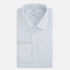 View 5 of product The Turnbull & Asser Navy and Blue Shadow Stripe Mayfair Shirt, featuring a classic T&A collar and buttoned cuffs, is laid flat on a white background.
