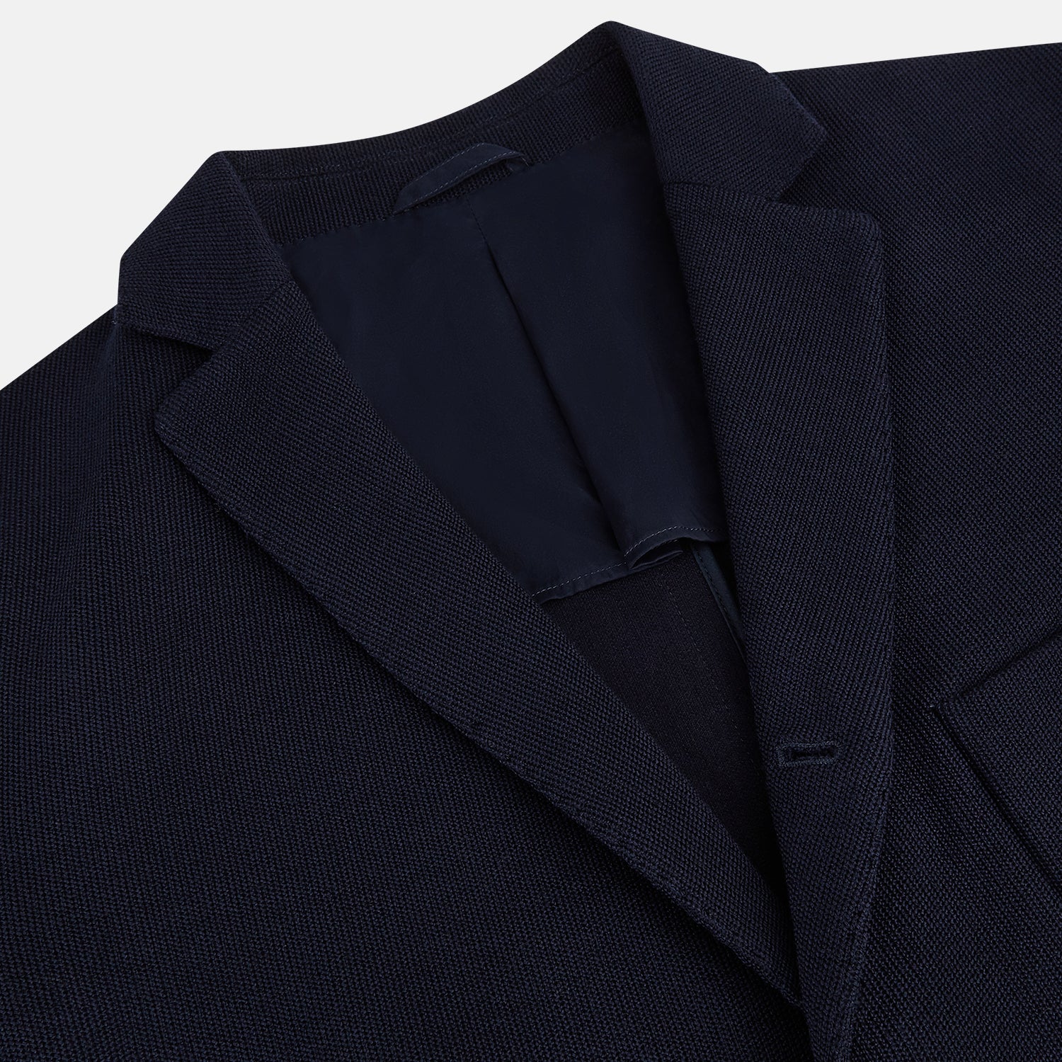 Image 2 of product The Navy Knitted Oxford Blazer by Turnbull & Asser features notch lapels, two front buttons, a chest pocket, and two lower patch pockets, shown against a plain white background.