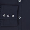 View 4 of product The Navy Westminster Shirt by Turnbull & Asser is a classic long-sleeve, button-up shirt with a pointed collar and buttoned cuffs, exemplifying British craftsmanship, shown against a plain white background.