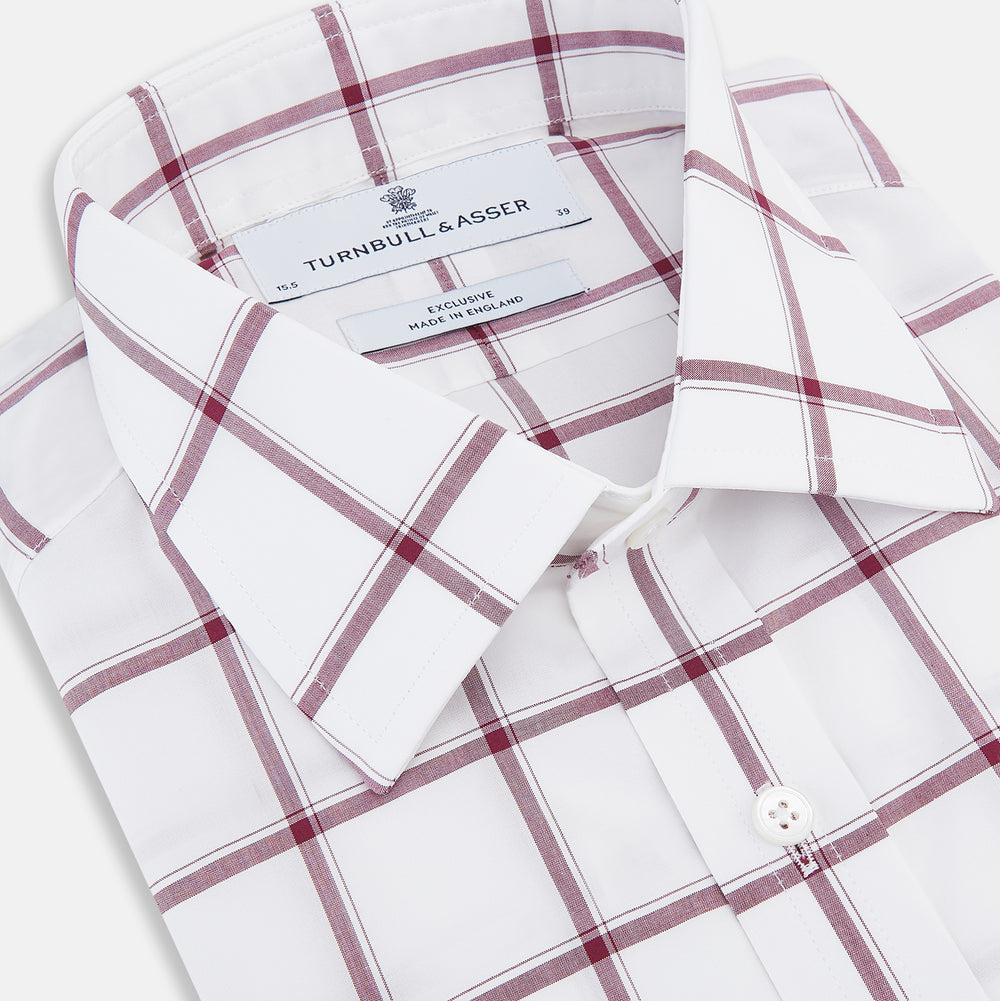 A long-sleeve, button-up Burgundy Grid Check Mayfair Shirt by Turnbull & Asser, made from Italian cotton with a spread collar and red grid check pattern, displayed flat on a plain white background.