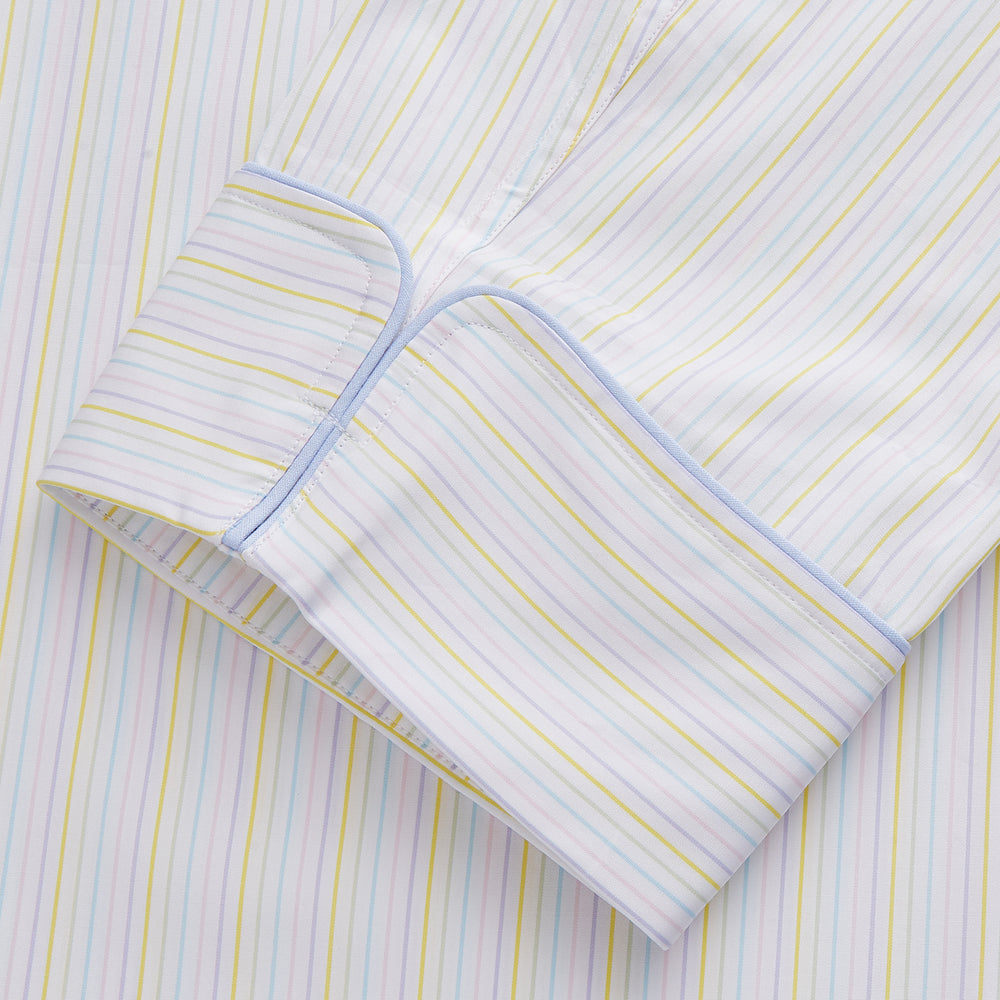 The Yellow Multi Stripe Cotton Quin Pyjama Set by Turnbull & Asser features a striped button-up top with chest pocket and drawstring pants—luxury sleepwear crafted from soft cotton, displayed on a white background.