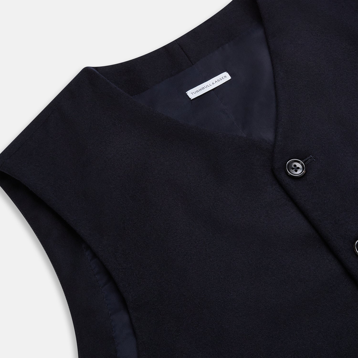 View 2 of product The Turnbull & Asser Navy Single-breasted Waistcoat is a sleeveless wool-cashmere piece with a small chest pocket and two side pockets, shown against a white background—an ideal addition to your winter wardrobe.
